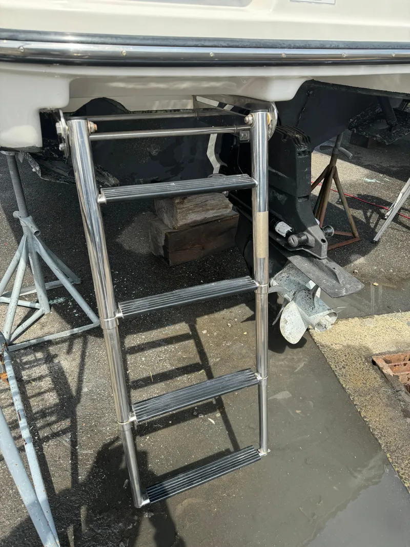 Slide: The Image of 2013 Sea Ray 270 SLX boat with extended swim ladder. - 8