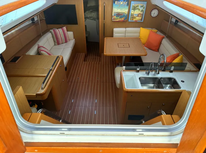 Slide: The Image of Interior of 2010 Jeanneau Sun Odyssey 50 DS yacht with modern furnishings and wood finish. - 11
