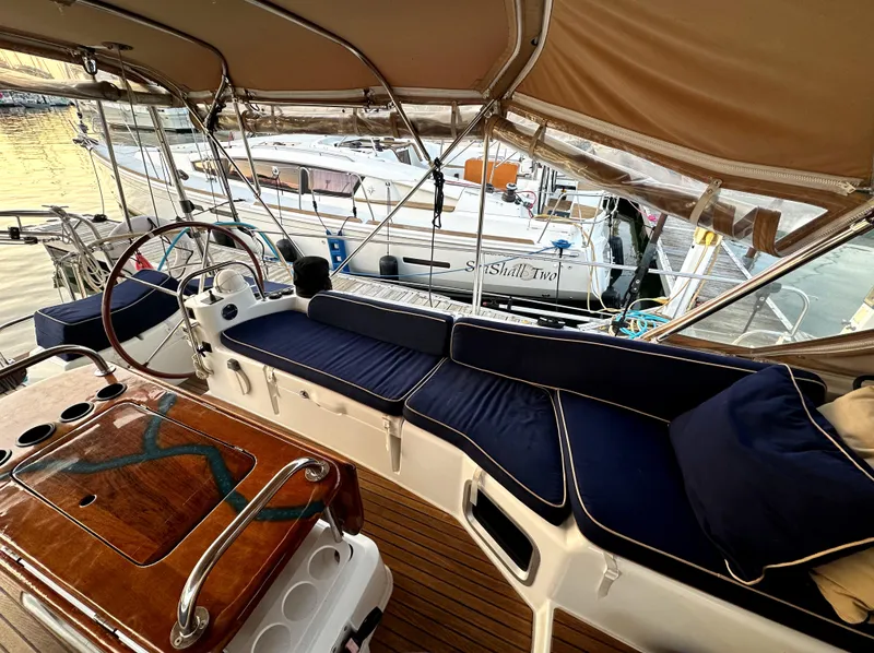 Slide: The Image of 2010 Jeanneau Sun Odyssey 50 DS yacht interior with blue seating and wooden accents. - 12