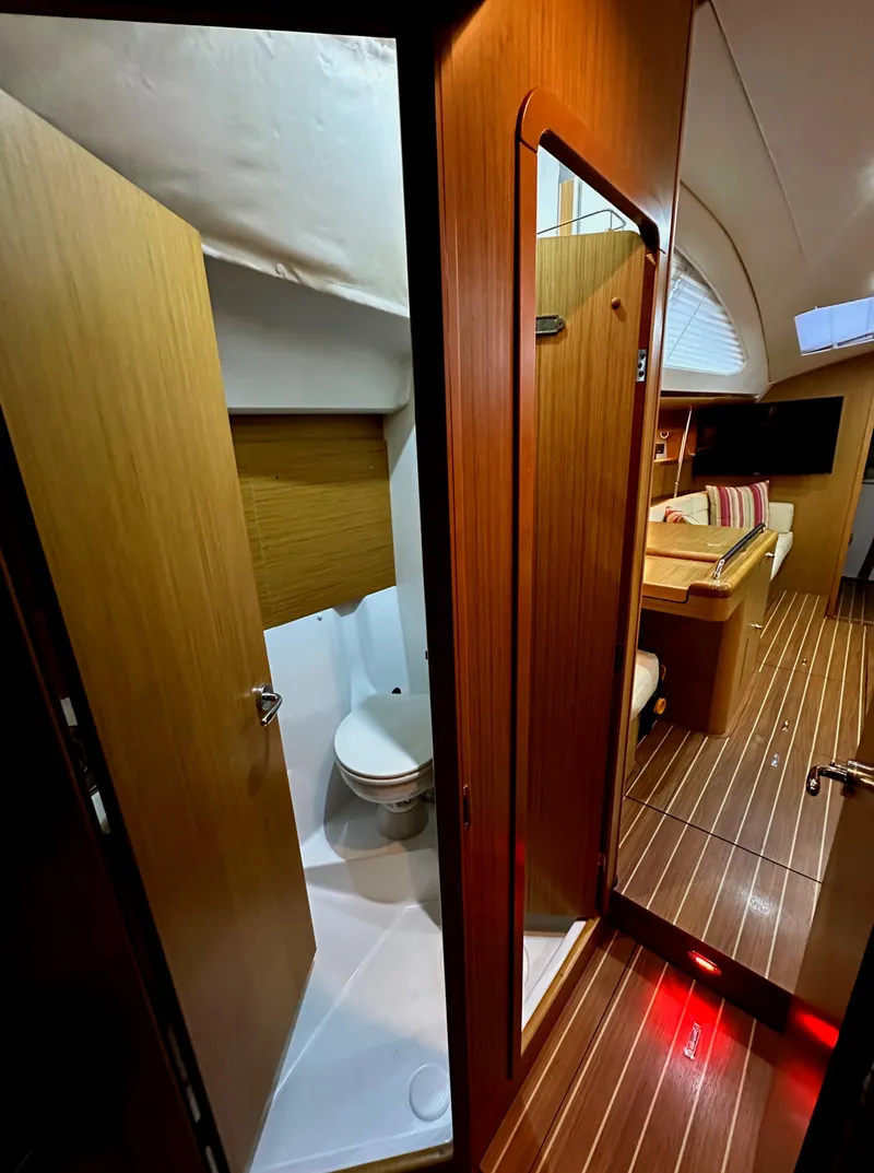 Slide: The Image of Interior of 2010 Jeanneau Sun Odyssey 50 DS yacht, featuring bathroom and cabin area. - 25