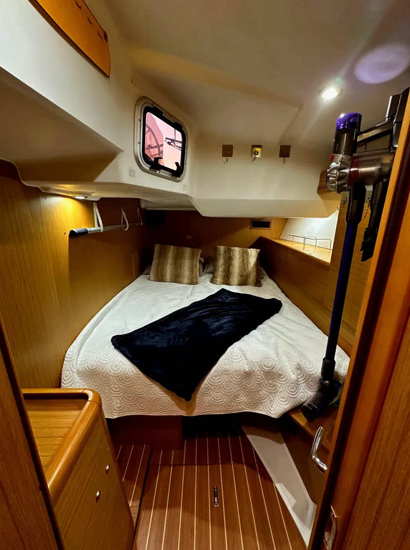 Slide: The Image of Cozy cabin interior of 2010 Jeanneau Sun Odyssey 50 DS sailboat with elegant bedding. - 27