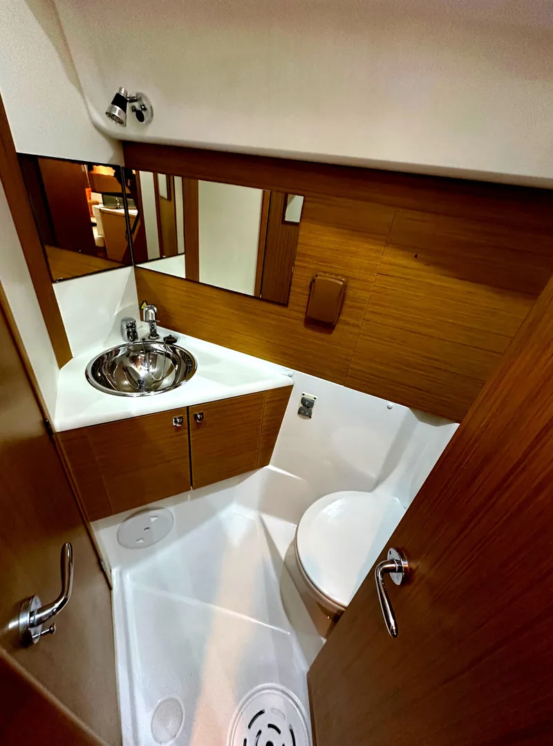 Slide: The Image of Compact bathroom in 2010 Jeanneau Sun Odyssey 50 DS yacht with modern fixtures. - 31
