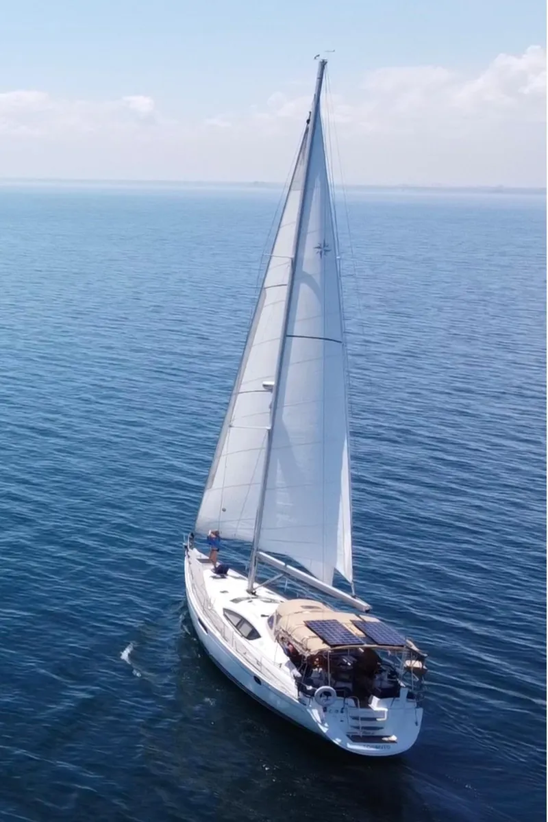 Slide: The Image of 2010 Jeanneau Sun Odyssey 50 DS sailing on open sea under clear skies. - 39