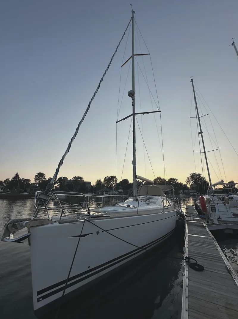 Slide: The Image of 2010 Jeanneau Sun Odyssey 50 DS sailboat docked at sunset. - 4