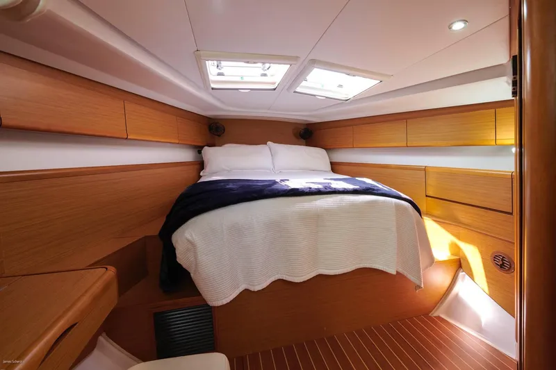 Slide: The Image of Luxurious cabin interior of 2010 Jeanneau Sun Odyssey 50 DS yacht, featuring cozy bedding. - 40