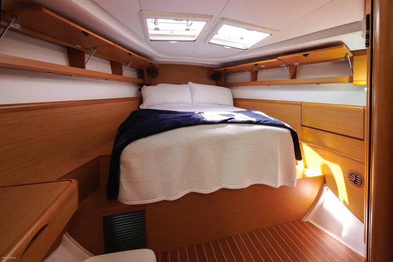 Slide: The Image of Cozy cabin interior of 2010 Jeanneau Sun Odyssey 50 DS with wooden finish and skylights. - 41