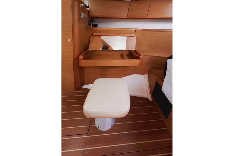 Slide: The Image of Interior of 2010 Jeanneau Sun Odyssey 50 DS with wooden finish and cushioned seat. - 43