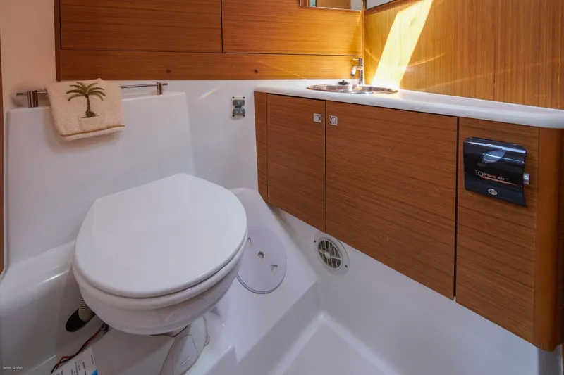 Slide: The Image of Bathroom interior of 2010 Jeanneau Sun Odyssey 50 DS yacht, featuring modern fixtures and wood cabinetry. - 44