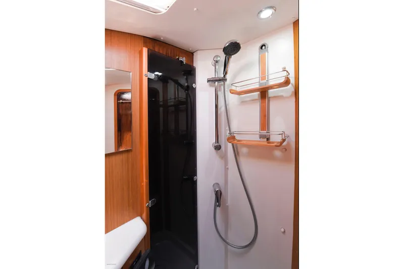 Slide: The Image of Shower area in 2010 Jeanneau Sun Odyssey 50 DS yacht, featuring modern fixtures and wooden accents. - 45