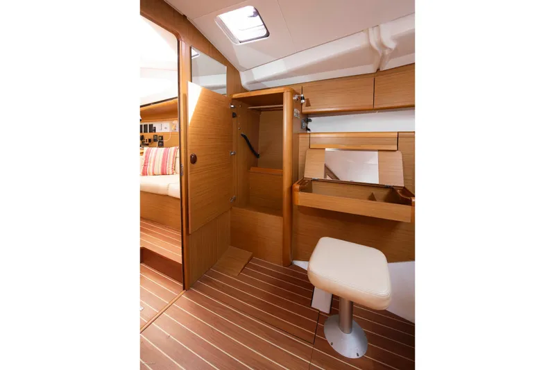 Slide: The Image of Interior of 2010 Jeanneau Sun Odyssey 50 DS, featuring wooden cabinetry and seating. - 46