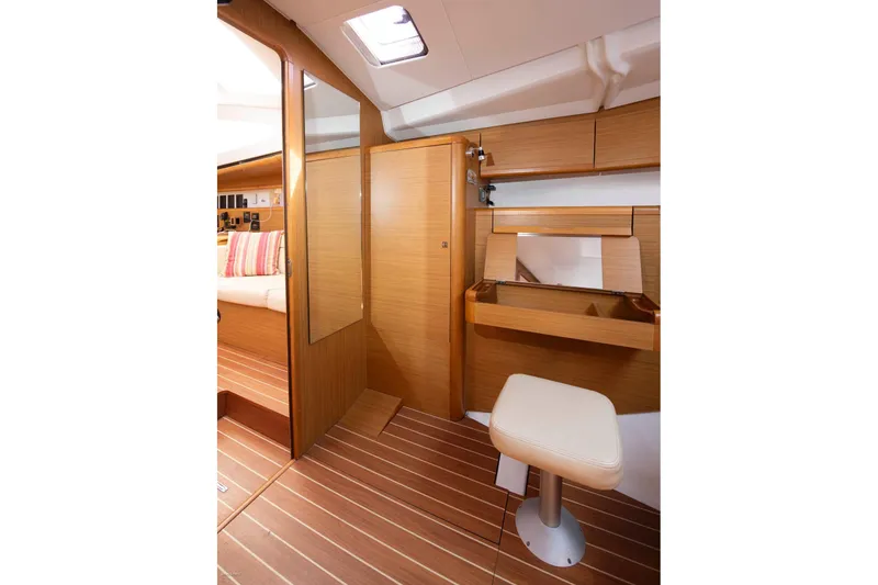 Slide: The Image of Interior of 2010 Jeanneau Sun Odyssey 50 DS, featuring wooden cabinetry and seating. - 47