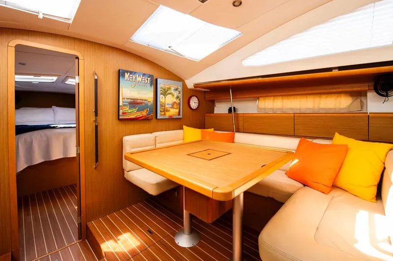 Slide: The Image of Interior of 2010 Jeanneau Sun Odyssey 50 DS yacht with cozy seating and vibrant decor. - 50