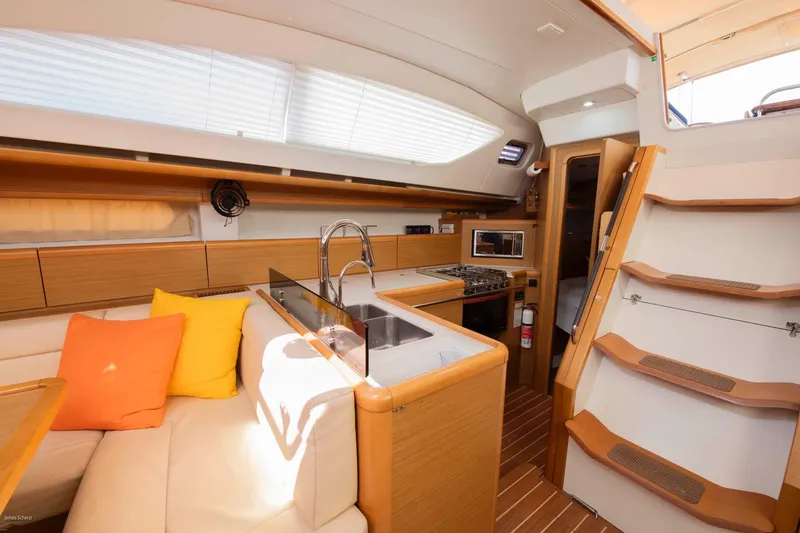 Slide: The Image of Interior of 2010 Jeanneau Sun Odyssey 50 DS yacht with modern kitchen and seating area. - 52