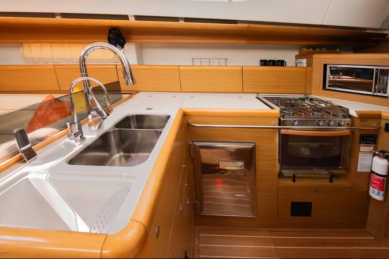 Slide: The Image of Modern kitchen in 2010 Jeanneau Sun Odyssey 50 DS yacht with stainless steel appliances. - 54