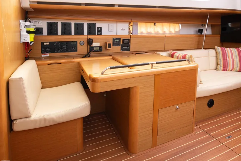 Slide: The Image of Interior of 2010 Jeanneau Sun Odyssey 50 DS yacht with navigation station and seating area. - 55