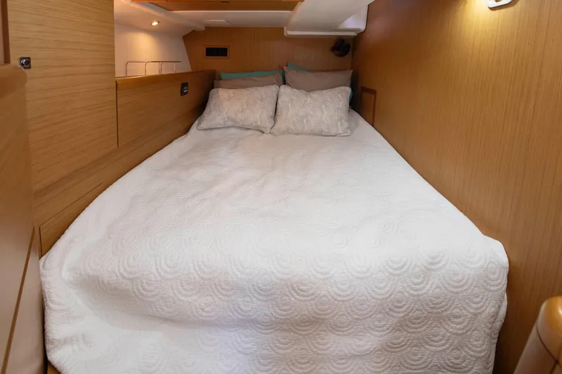 Slide: The Image of Cozy cabin interior of 2010 Jeanneau Sun Odyssey 50 DS with comfortable bedding. - 58