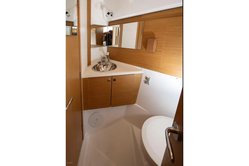 Slide: The Image of Bathroom interior of 2010 Jeanneau Sun Odyssey 50 DS yacht, featuring modern fixtures and wood accents. - 61