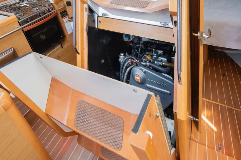 Slide: The Image of Engine compartment of 2010 Jeanneau Sun Odyssey 50 DS sailboat, featuring Yanmar engine. - 64