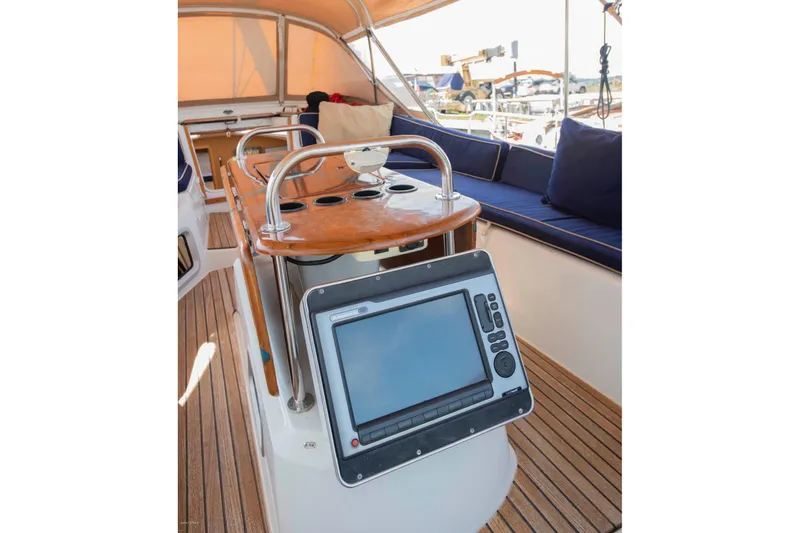 Slide: The Image of Cockpit of 2010 Jeanneau Sun Odyssey 50 DS with navigation equipment and seating. - 67