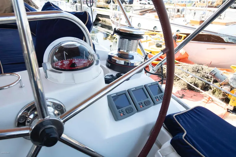 Slide: The Image of Cockpit of 2010 Jeanneau Sun Odyssey 50 DS with compass and navigation instruments. - 68