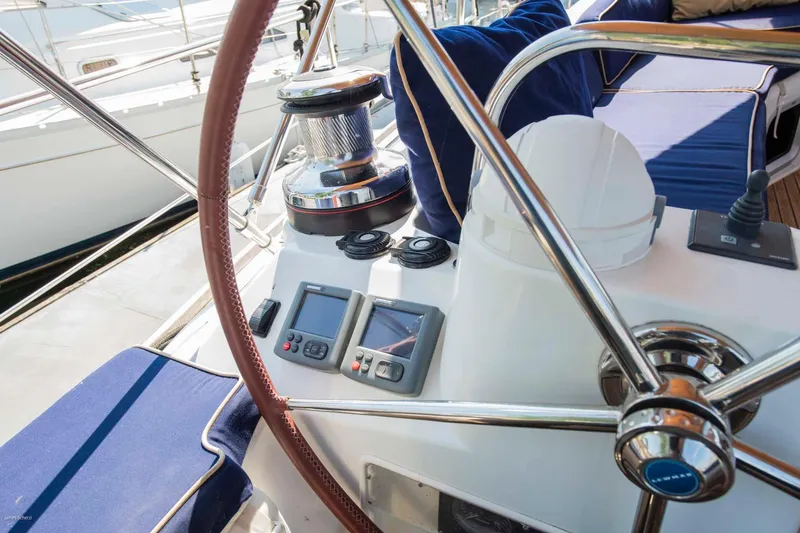 Slide: The Image of Cockpit of 2010 Jeanneau Sun Odyssey 50 DS with steering wheel and navigation instruments. - 69