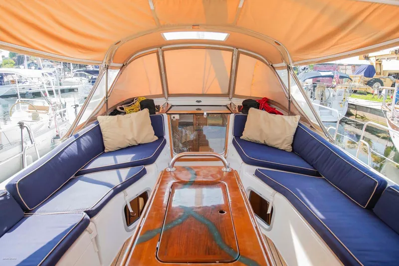 Slide: The Image of Jeanneau Sun Odyssey 50 DS 2010 yacht cockpit with blue cushions and orange canopy. - 70