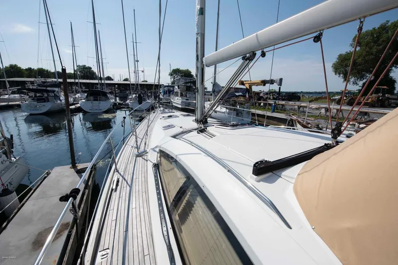 Slide: The Image of 2010 Jeanneau Sun Odyssey 50 DS sailboat docked at marina, sunny day. - 73