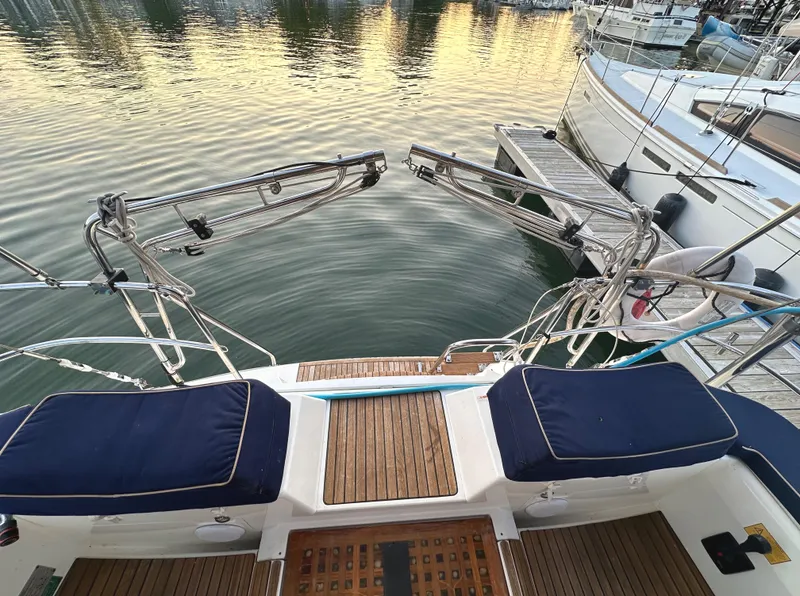 Slide: The Image of Jeanneau Sun Odyssey 50 DS, 2010 model, docked with open transom and blue cushions. - 8