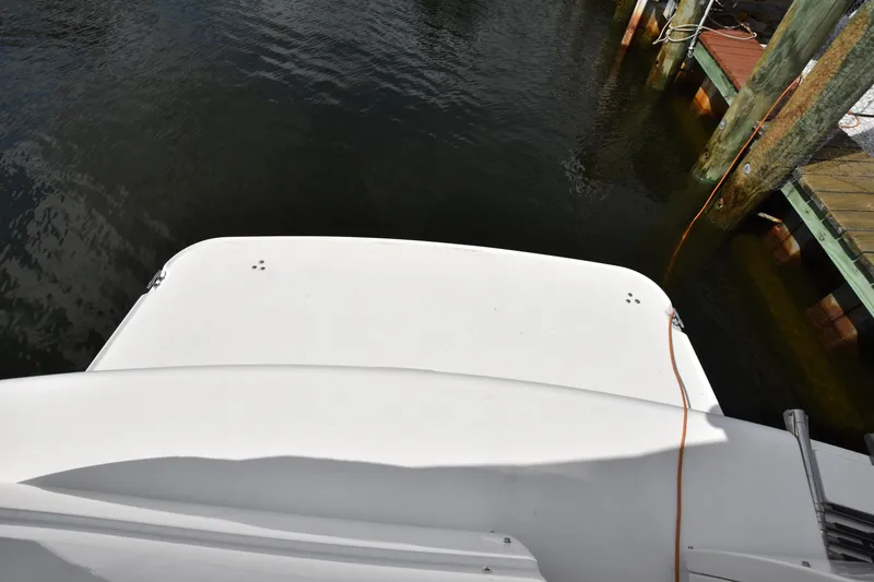 Slide: The Image of 2001 Larson Cabrio 330 boat stern view at dock. - 8