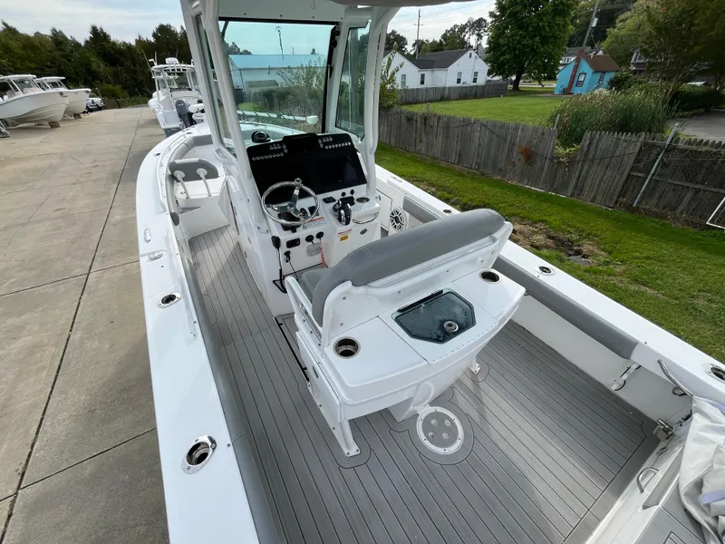 Slide: The Image of 2023 Everglades 253 Center Console boat with sleek design and modern features. - 11