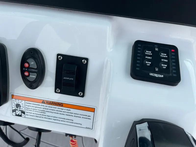 Slide: The Image of Control panel of 2023 Everglades 253 Center Console boat with warning label. - 19