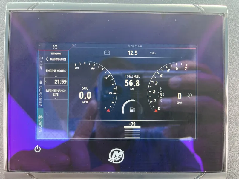 Slide: The Image of Dashboard display of 2023 Everglades 253 Center Console showing fuel, engine hours, and voltage. - 20