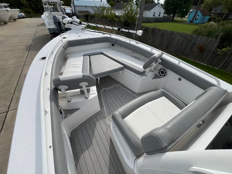 Slide: The Image of 2023 Everglades 253 Center Console boat interior with seating and steering wheel. - 23