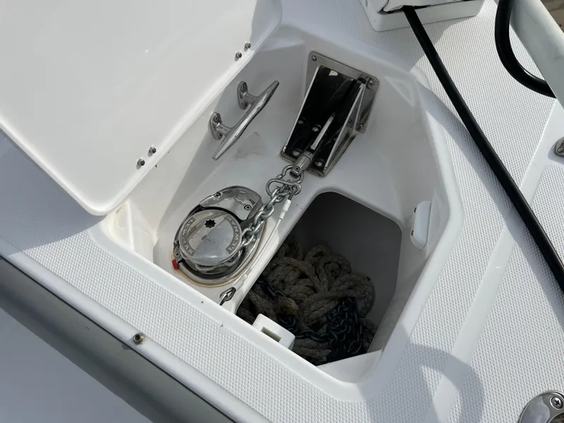 Slide: The Image of 2023 Everglades 253 Center Console anchor storage with chain and rope. - 31