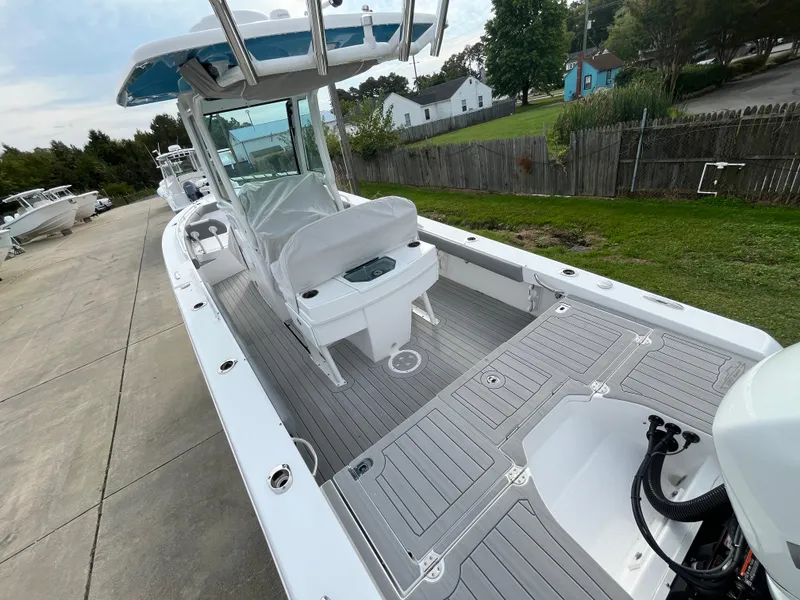 Slide: The Image of 2023 Everglades 253 Center Console boat with spacious deck and modern design. - 9