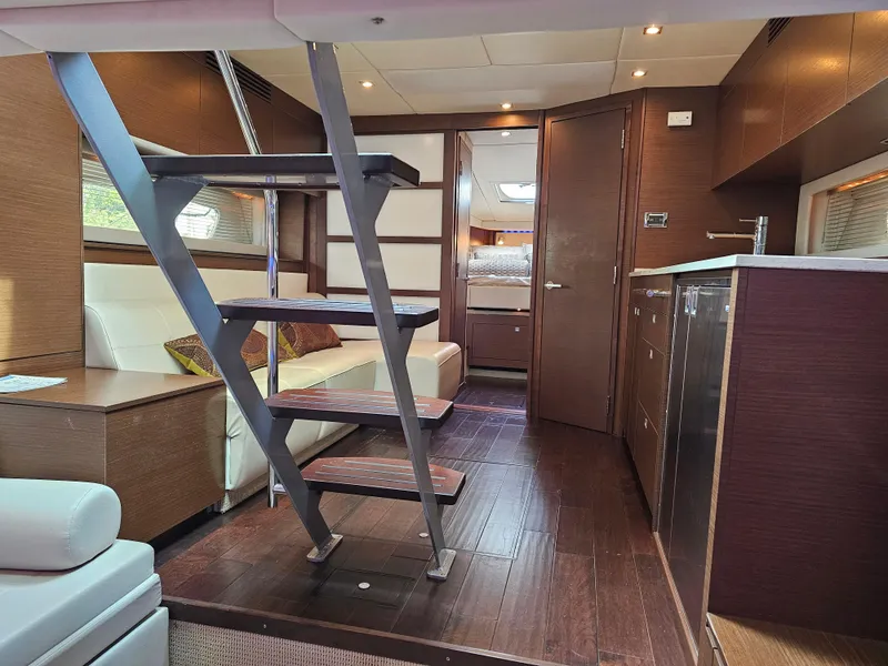 Slide: The Image of Interior of 2012 Sea Ray SUNDANCE yacht with modern design and wooden flooring. - 10