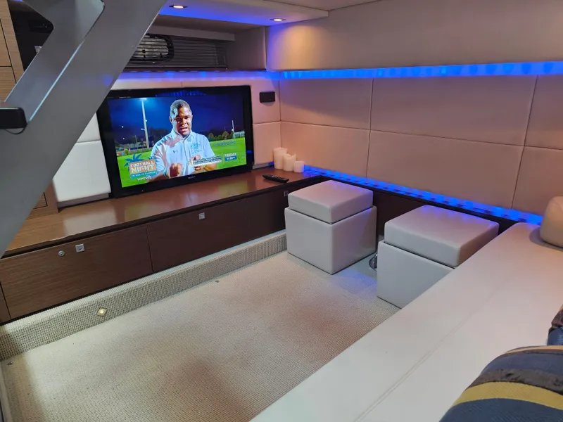 Slide: The Image of Luxurious interior of 2012 Sea Ray SUNDANCE yacht with modern entertainment setup. - 12