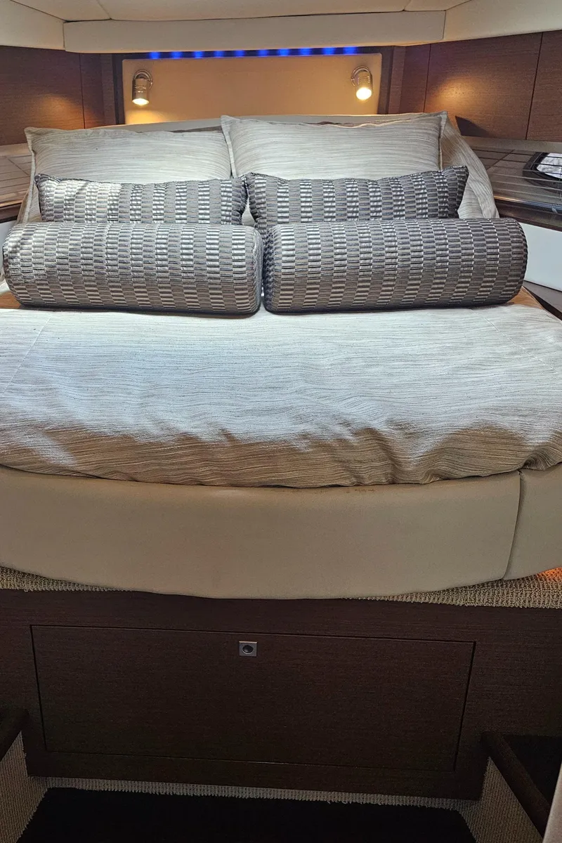 Slide: The Image of Luxurious bedroom interior of 2012 Sea Ray SUNDANCE yacht with elegant bedding. - 14