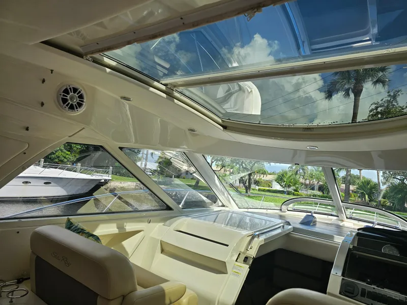 Slide: The Image of Interior view of 2012 Sea Ray SUNDANCE yacht with sunroof and luxurious seating. - 7