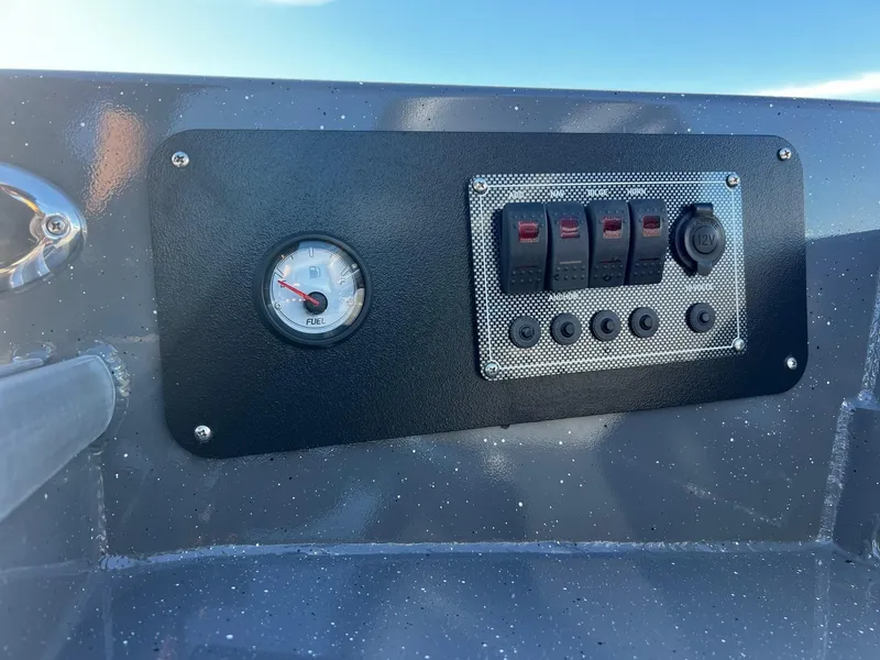 Slide: The Image of Control panel of 2025 Fish Rite Angler 18 boat with fuel gauge and switches. - 10