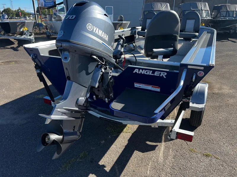 Slide: The Image of 2025 Fish Rite Angler 18 boat with Yamaha motor, parked on a trailer. - 13