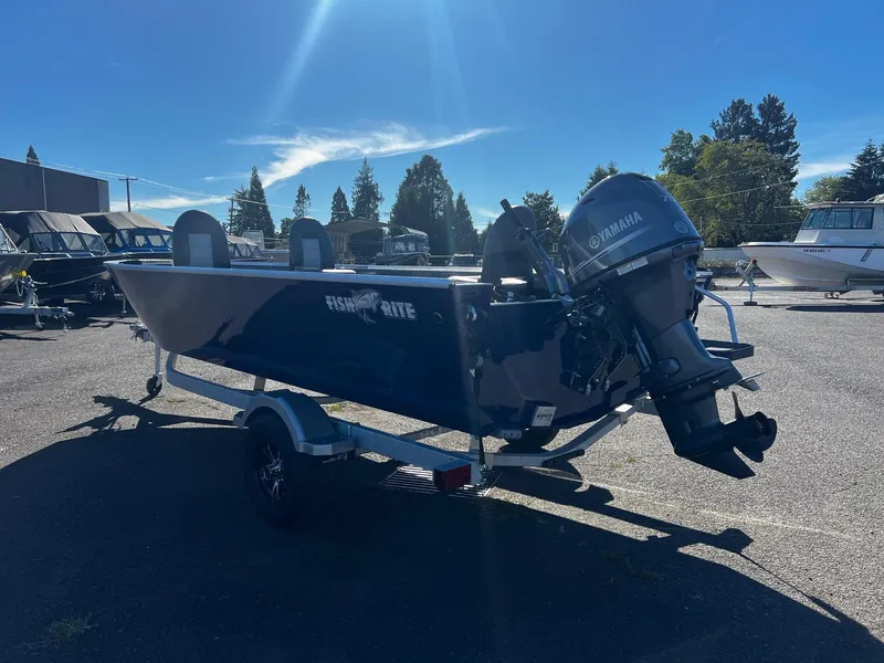 Slide: The Image of 2025 Fish Rite Angler 18 boat with Yamaha outboard motor in a sunny outdoor setting. - 4