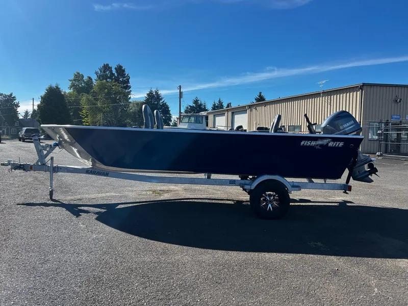 Slide: The Image of 2025 Fish Rite Angler 18 boat on trailer in sunny outdoor setting. - 5