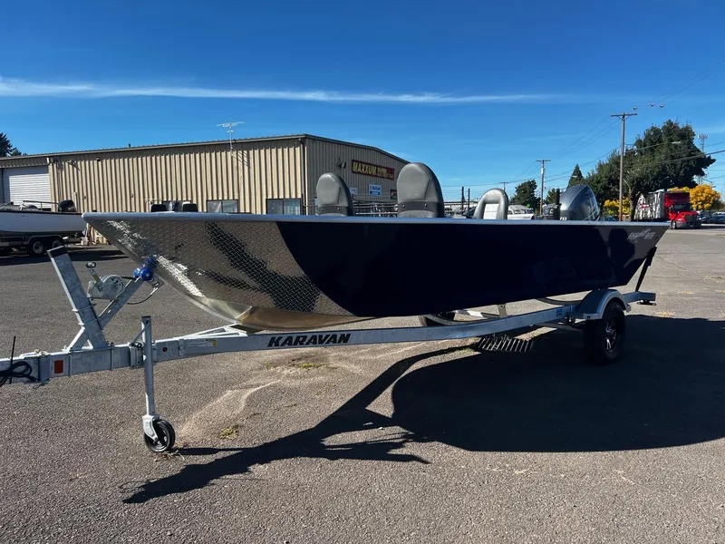 Slide: The Image of 2025 Fish Rite Angler 18 boat on Karavan trailer in parking lot. - 6