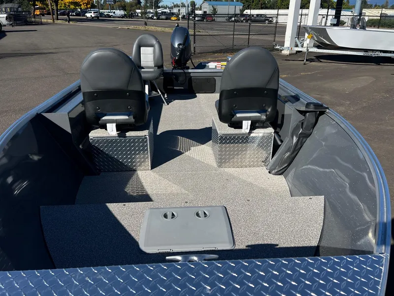 Slide: The Image of 2025 Fish Rite Angler 18 boat interior with seating and storage compartments. - 7