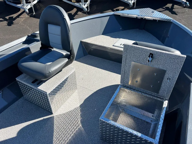 Slide: The Image of 2025 Fish Rite Angler 18 boat interior with seating and storage compartments. - 8