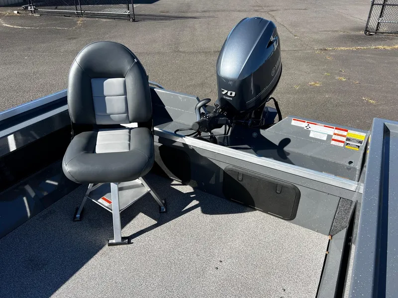 Slide: The Image of 2025 Fish Rite Angler 18 boat with motor and seating. - 9