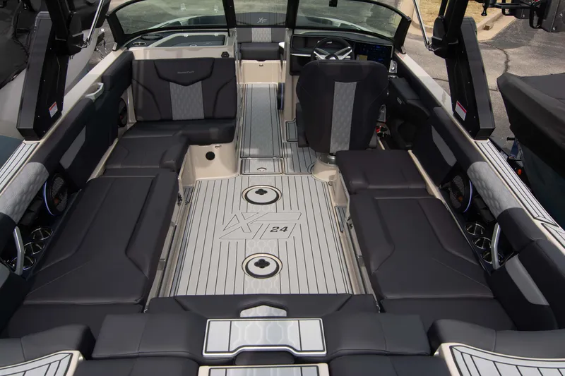 Slide: The Image of 2025 MasterCraft XT24 boat interior with sleek seating and modern design. - 15