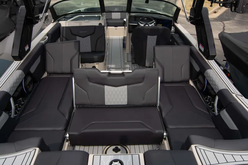 Slide: The Image of 2025 MasterCraft XT24 boat interior with luxurious seating and modern design. - 16