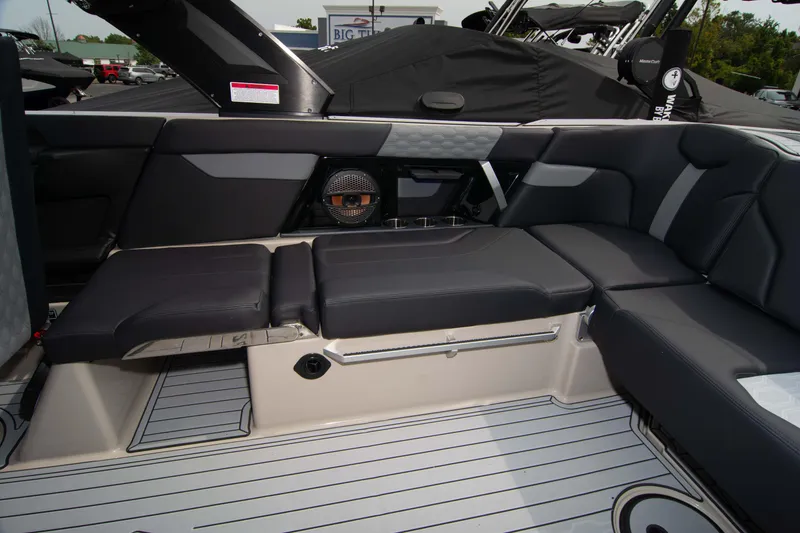 Slide: The Image of 2025 MasterCraft XT24 boat interior with sleek seating and modern design. - 17